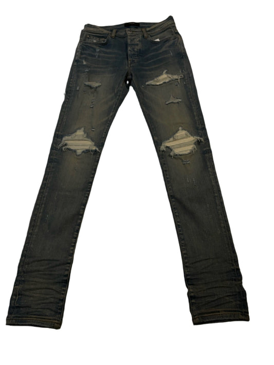 AMIRI RIPPED JEANS